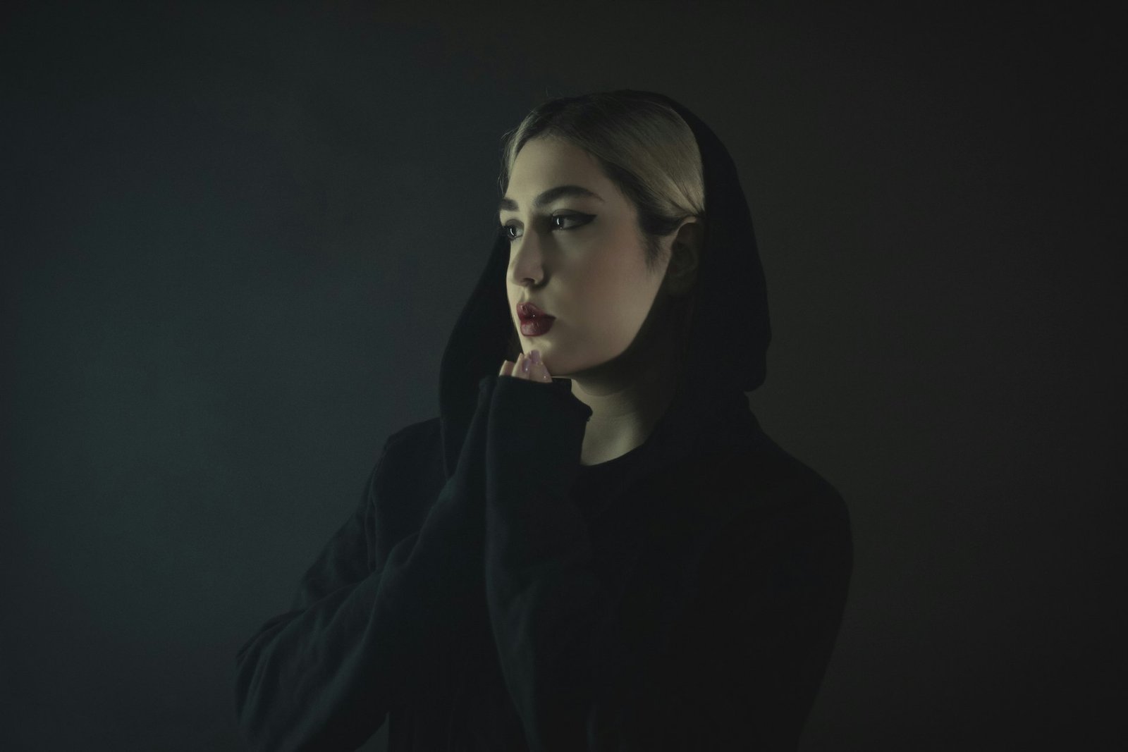 Yosile founder portrait, dark moody studio light