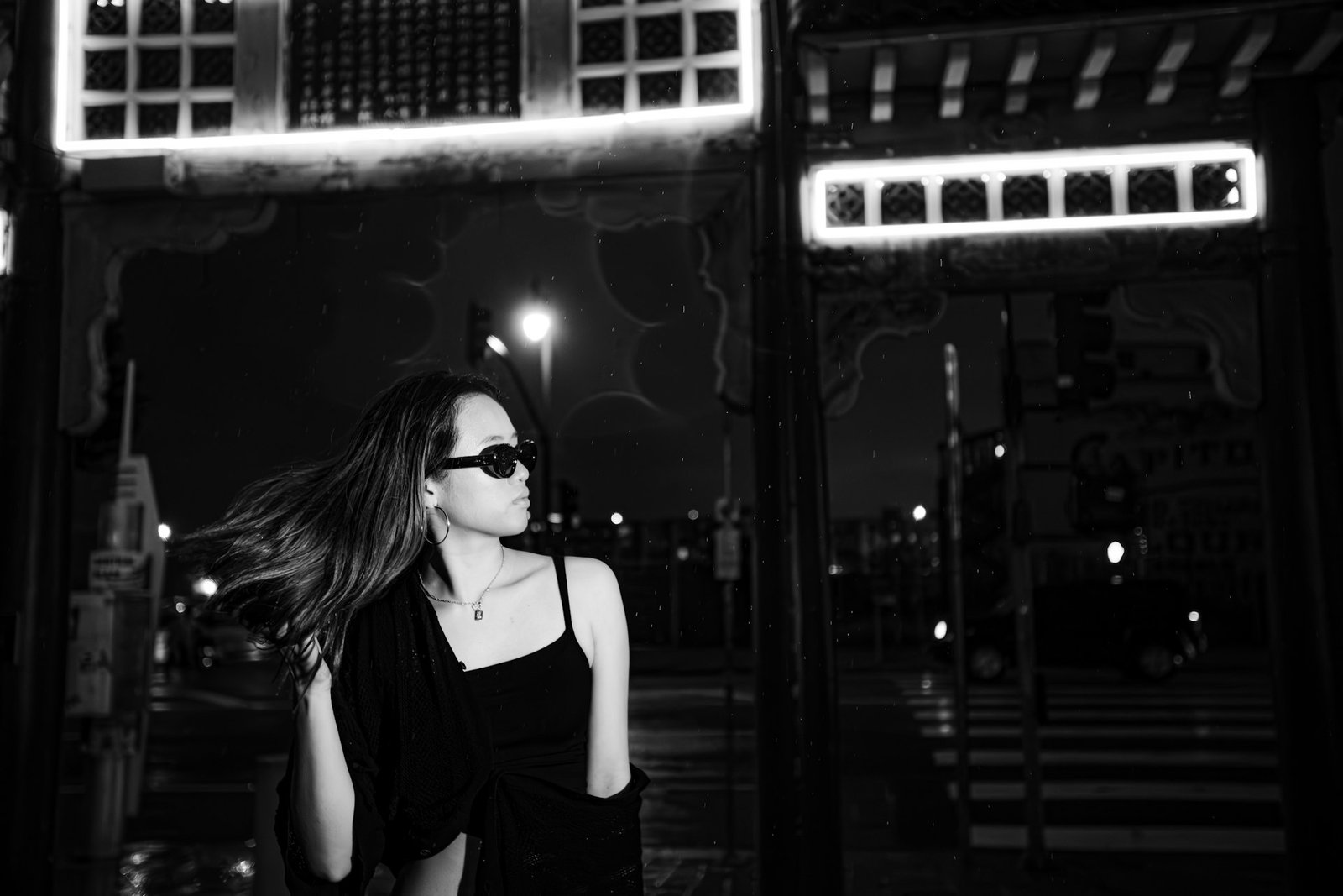Editorial streetwear model at night with neon lights